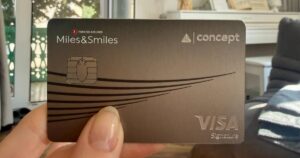 TBC Concept Visa Signature Miles&Smiles card held in hand